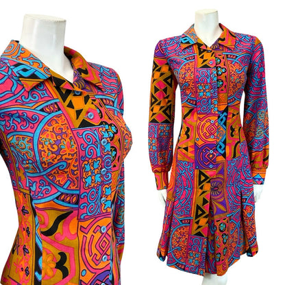 Mannequin wears a 70s Lucie Linden orange pink blue and purple psychedelic pleated skirt dress.
