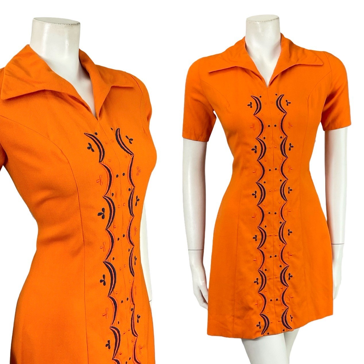Mannequin wears a bright orange short sleeved mod 60s 70s shirt dress with blue geometric embroidery
