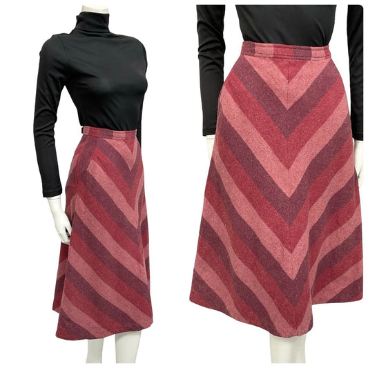 Mannequin wears a 60s 70s plum and red wool chevron print midi skirt and a black turtleneck.