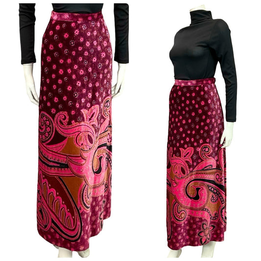 Mannequin wears a 70s pink and plum psychedelic paisley print velvet maxi skirt with a black turtleneck