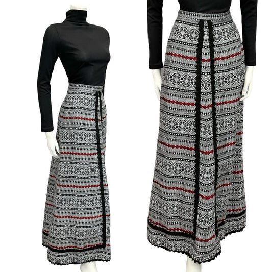 Mannequin wears a 60s 70s white black and red folk ric rac maxi skirt with a black turtleneck