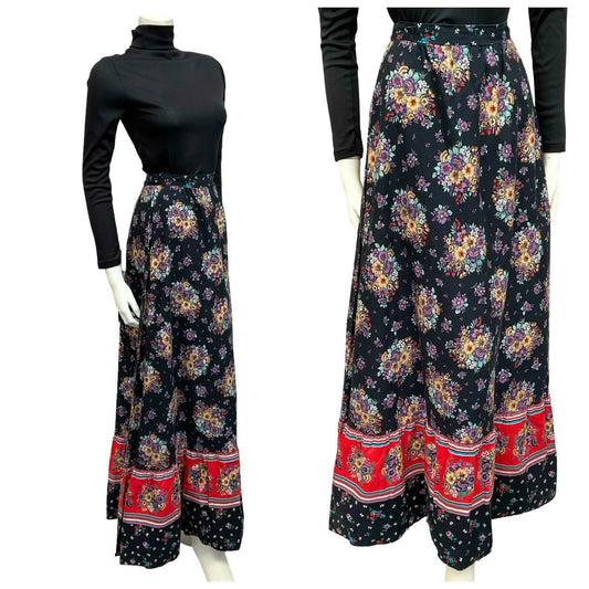 Mannequin wears a 70s black red and blue floral folk printed maxi skirt and a black turtleneck