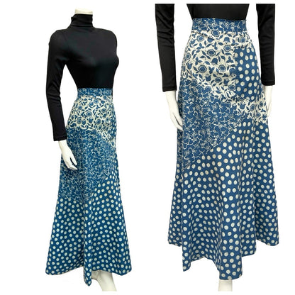Mannequin wears a blue and cream 70s patchwork folk dotty maxi skirt with a black turtleneck