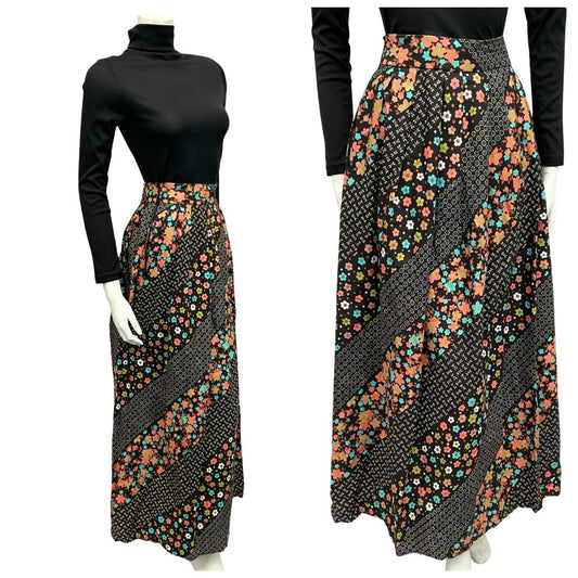 Mannequin wears a 70s black and pink floral striped maxi skirt with a black turtleneck.