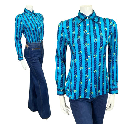 Mannequin wears a blue 60s 70s chain print dagger collar shirt with blue flared jeans 