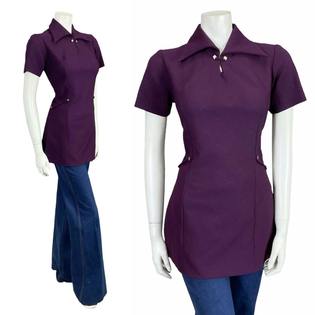 Shrinking Violets Vintage 60s 70s aubergine purple mod dagger collar space age blouse on a white mannequin wearing blue flared jeans 