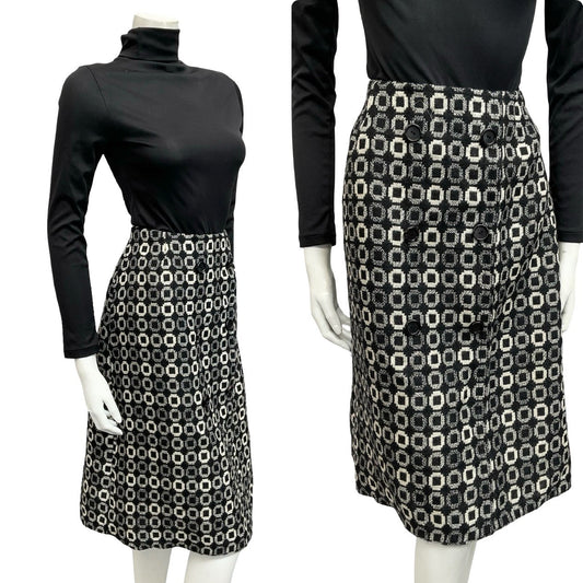 Shrinking Violets vintage black and white geometric dotty wool mod preppy midi skirt on a mannequin wearing a black turtleneck