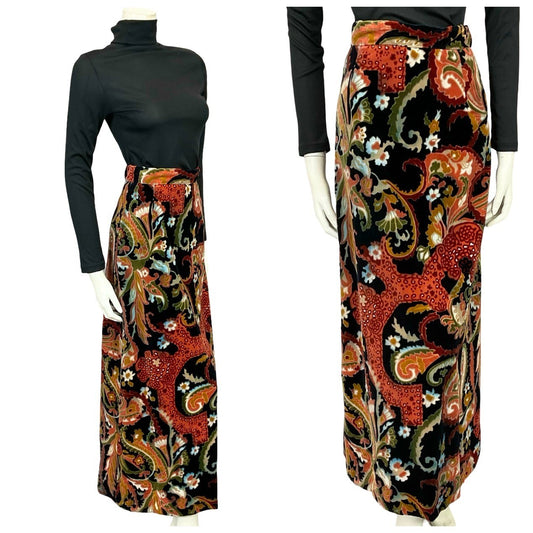 Shrinking Violets Vintage 60s 70s black red and green psychedelic velvet maxi skirt on a white mannequin wearing a black turtleneck