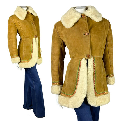 Shrinking violets vintage 60s 70s beige suede cream boho peplum shearling on a mannequin wearing blue flared jeans 