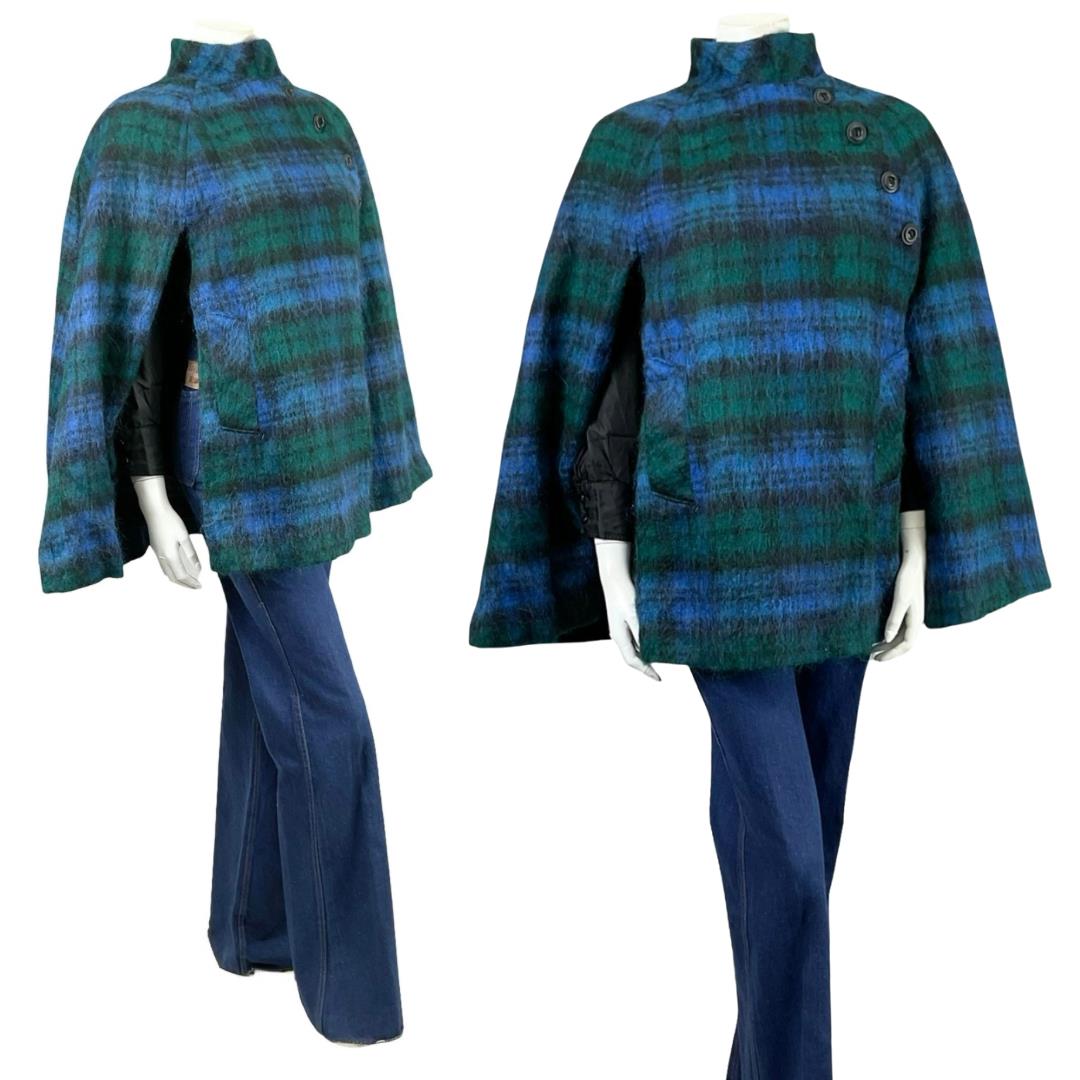 Shrinking Violets Vintage 60s 70s mod mohair wool blue and green plaid cape on a mannequin wearing blue flared jeans