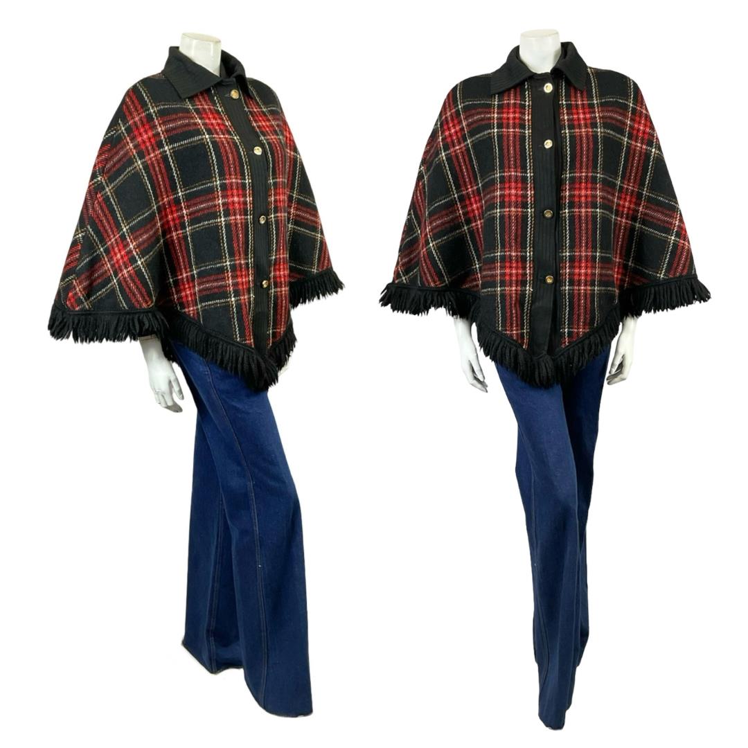 Shrinking Violets Vintage 60s 70s black and red tartan fringe cape on a white mannequin wearing blue flared jeans 