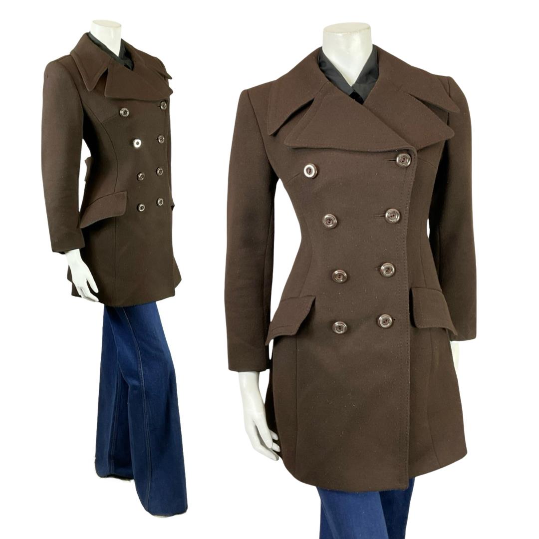 Shrinking Violets Vintage 60s 70s brown mod double breasted wool coat o a mannequin wearing blue flared jeans 
