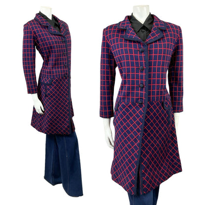 Shrinking Violets Vintage 60s 70s navy blue and red grid print mod coat on a white mannequin wearing blue flared jeans 