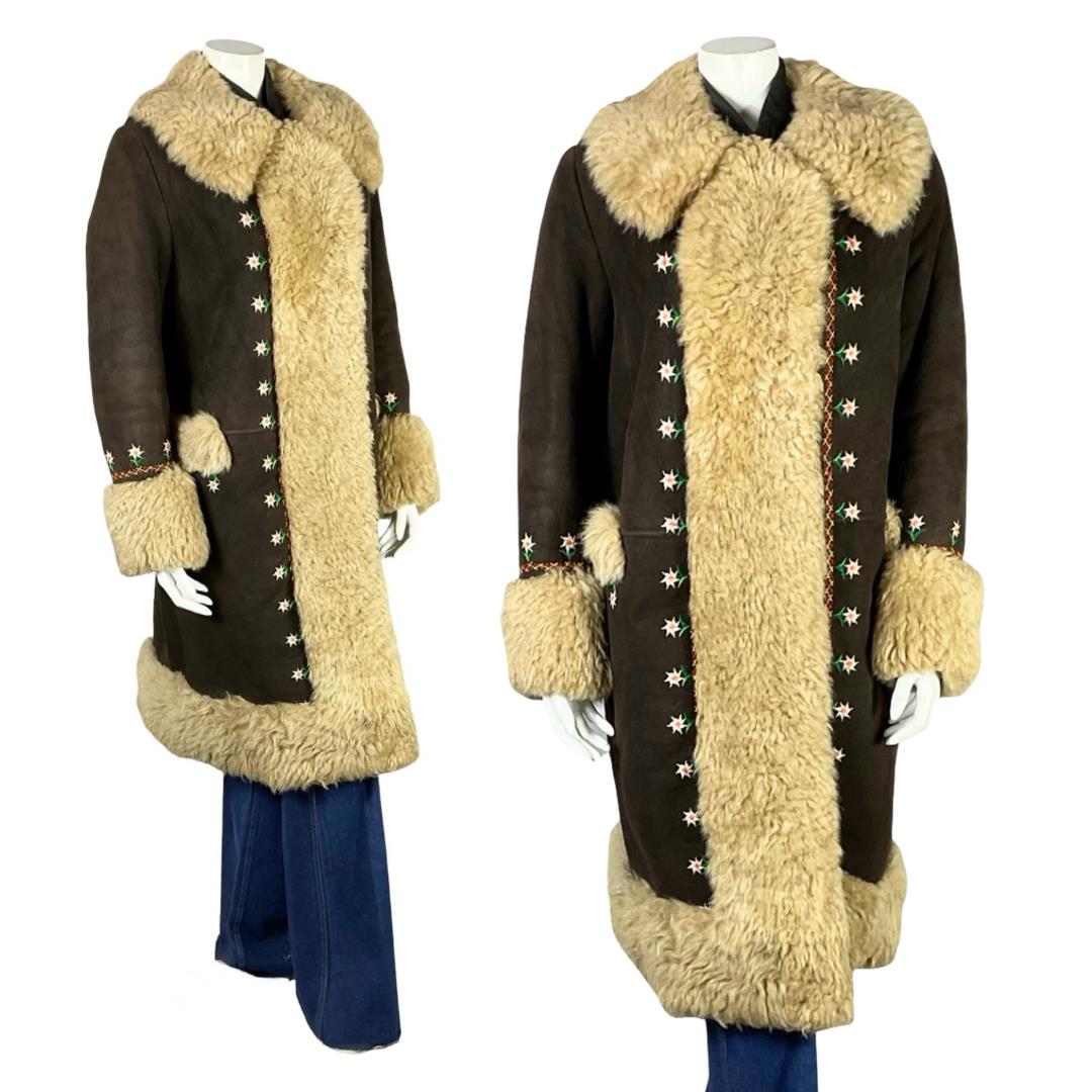 Shrinking Violets Vintage 60s 70s brown suede cream shearling coat with white daisy floral embroidery on a white mannequin