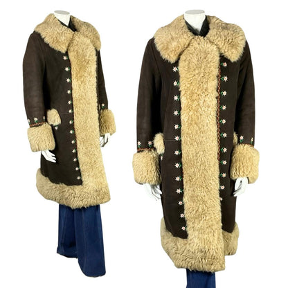 Shrinking Violets Vintage 60s 70s brown suede cream shearling coat with white daisy floral embroidery on a white mannequin