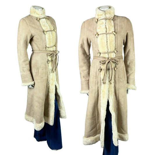 Shrinking Violets Vintage 60s 70s beige and cream Dr. Zhivago tie waist long shearling suede coat on a mannequin