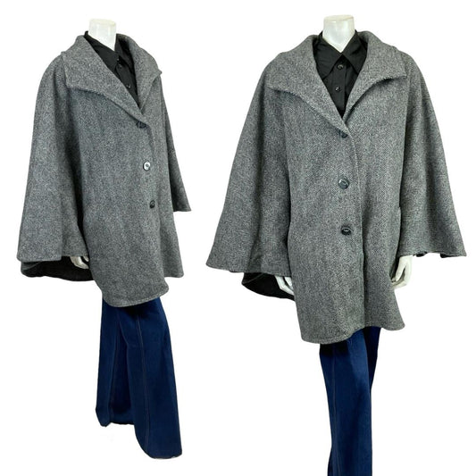 Vintage 60s 70s charcoal grey chevron wool cape on a white mannequin with blue flared jeans 