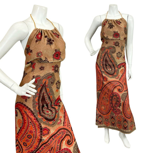 Vintage 60s 70s gold, red and orange lurex glittery paisley print blouson halter neck maxi dress on a white mannequin