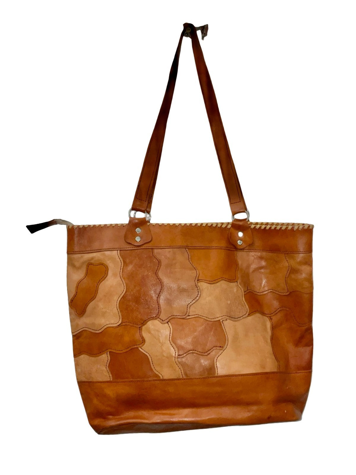 Vintage 70s large brown leather shopper bag with a wavy patchwork design and decorative whip stitch seam. 