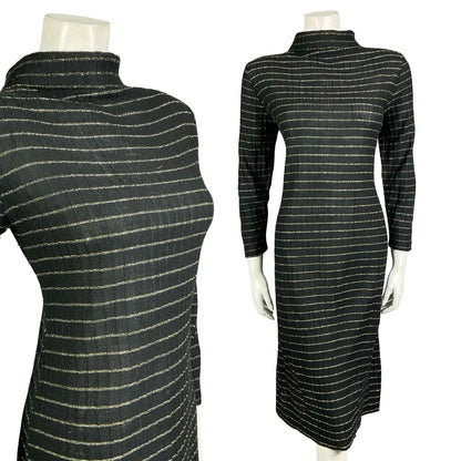Mannequin wears a black and gold striped lurex knitted long sleeve turtleneck party dress. 