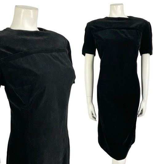 Mannequin wears a classic vintage 60s 70s short sleeve black velvet shift dress. 