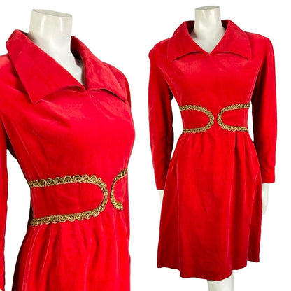 Mannequin wears a bright red velvet vintage 60s 70s shirt dress with a gold trim at the waistband. 