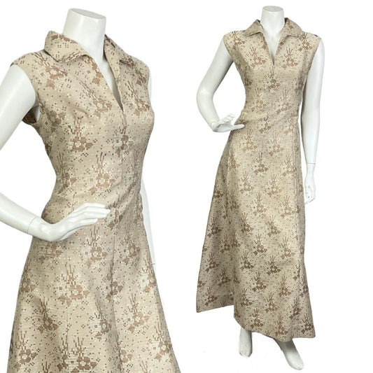 Mannequin wears a vintage 60s 70s sleeveless gold maxi dress with a dagger collar and glittery geometric print. 