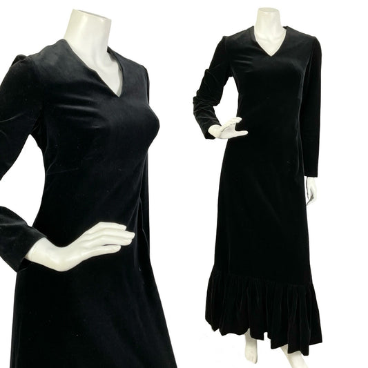 Mannequin wears a vintage black long sleeve maxi dress with a V-neckline and ruffle hemline. 