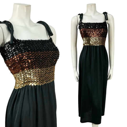 Mannequin wears a black strappy mini bandeau dress with a gold and brown sequin bust. 