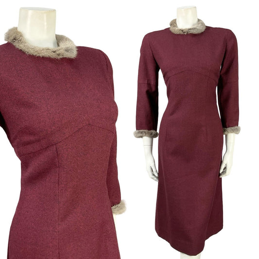 Mannequin wears a plum purple cropped sleeve mini dress with a fur neckline and cuff trim. 
