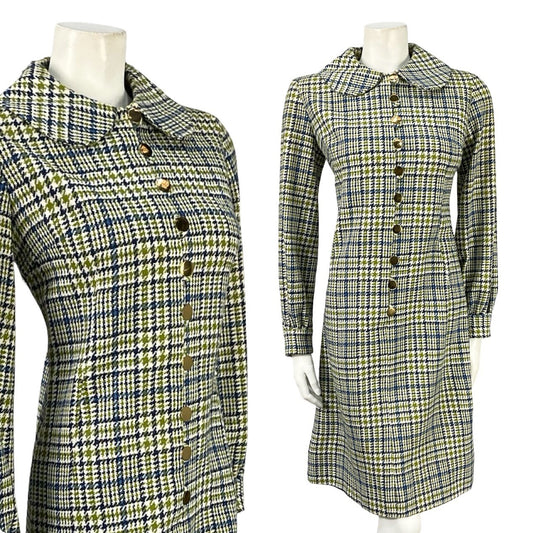 Mannequin wear a beige, black and blue plaid pattern vintage shirt dress with long sleeves and a Peter Pan collar. 
