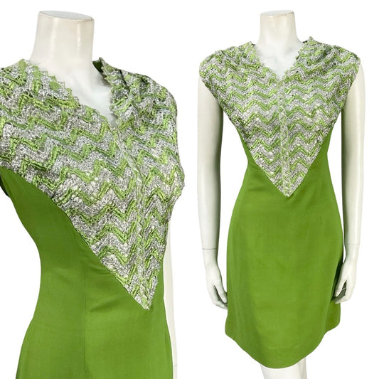 Mannequin wears a vintage 60s space age lurex chevron bib mini dress in green and silver. 