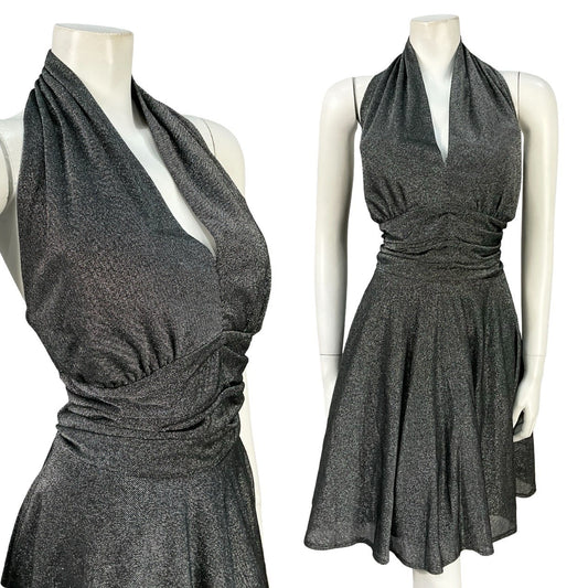 Mannequin wears a silver lurex vintage Japanese halter neck mini dress. 