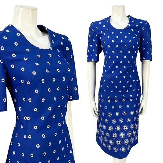 Mannequin wears a 60s vintage navy blue and white geometric, dotty short sleeved mini dress. 