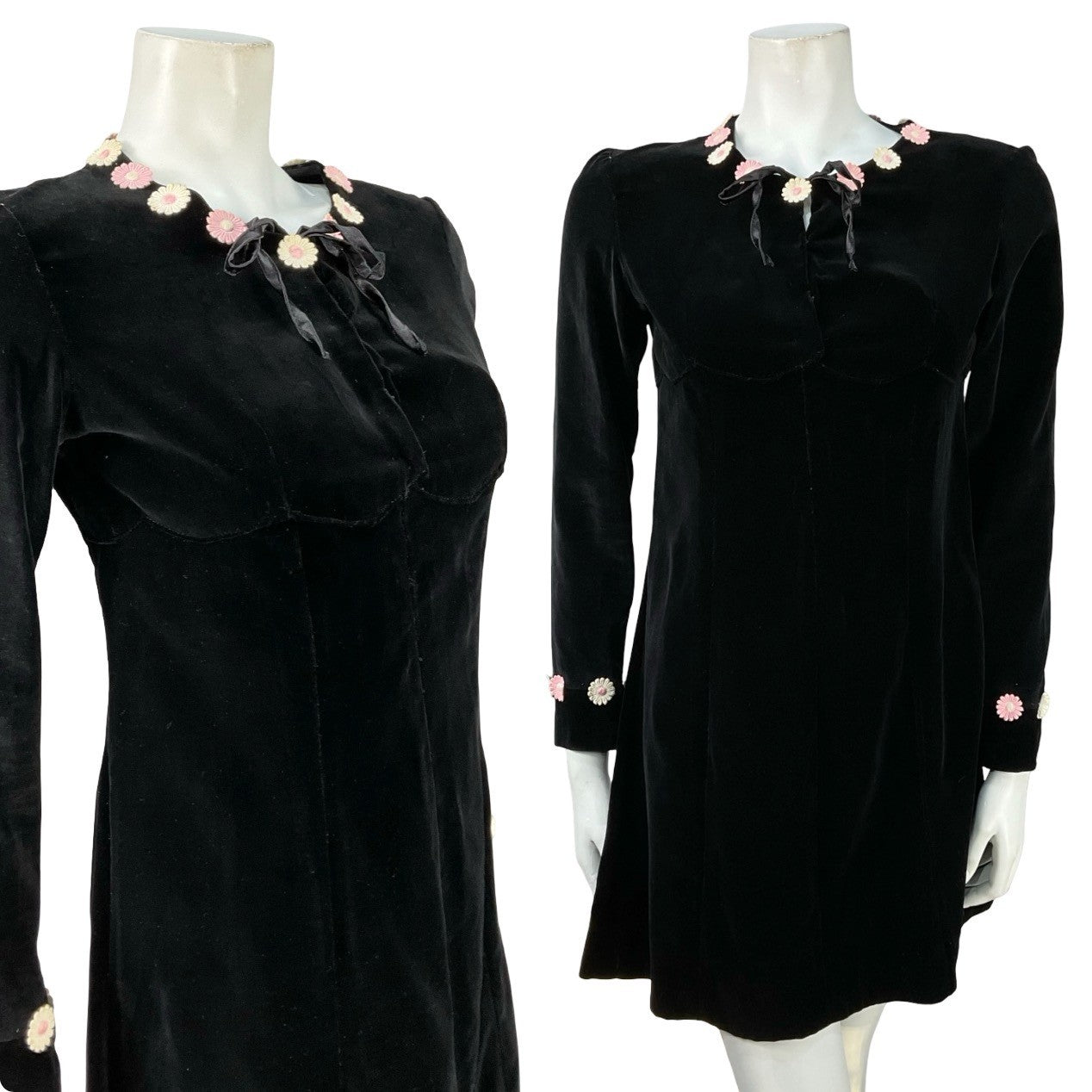 Mannequin wears a black velvet vintage handmade long sleeve shift dress with pink and white flower embellishments on the neckline. 