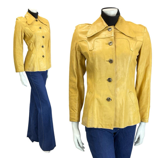 Mannequin wears flared indigo jeans with 70s vintage western yellow tan leather jacket with dagger collar, shot against white background