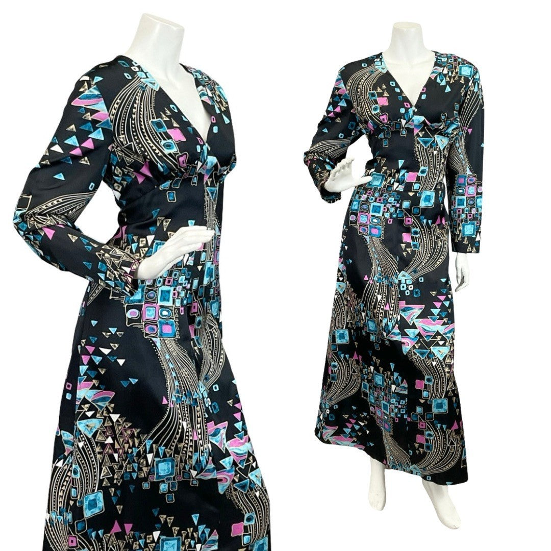 Mannequin wears a blue cream and purple geometric plunge neck maxi dress. 