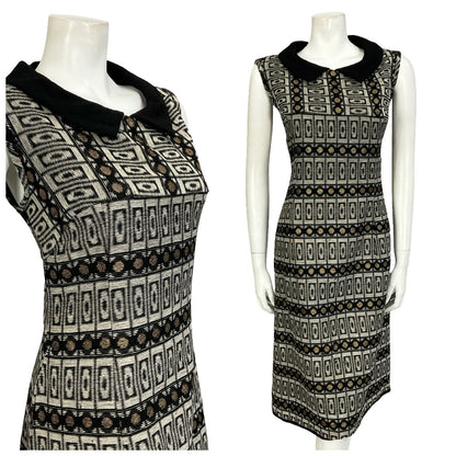 Mannequin wears a black grey and gold geometric peter pan collar sleeveless shift dress. 