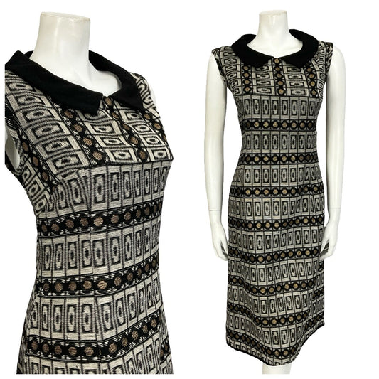 Mannequin wears a black grey and gold geometric peter pan collar sleeveless shift dress. 