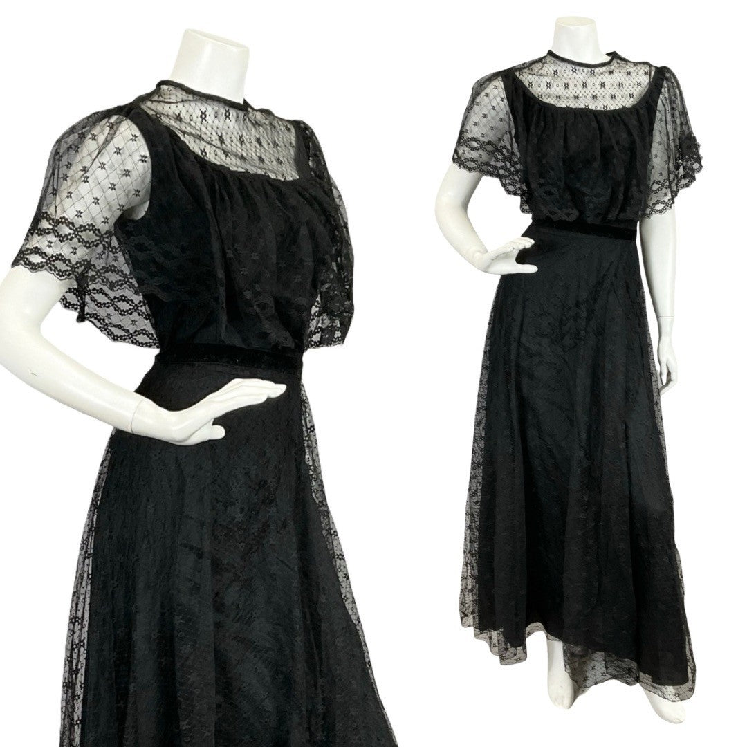 Mannequin wears a 60s 70s black lace cape sleeve gothic prairie maxi dress. 