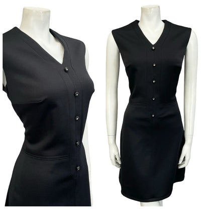 Mannequin wears a 60s sleeveless V neck mod black monochrome mini dress.