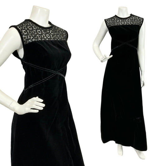 Mannequin wears a 60s 70s black velvet sleeveless maxi dress with black panelling. 