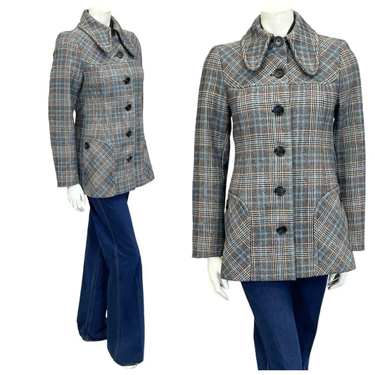 Mannequin wears a 60s mod grey and blue plaid dog ear collar coat with blue flared jeans