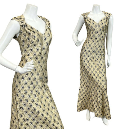 Mannequin wears a gold and navy blue glittery plaid sweetheart neckline maxi dress. 