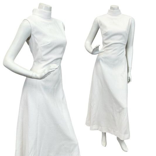 Mannequin wears a 60s 70s white mod sleeveless maxi dress with a funnel neck. 