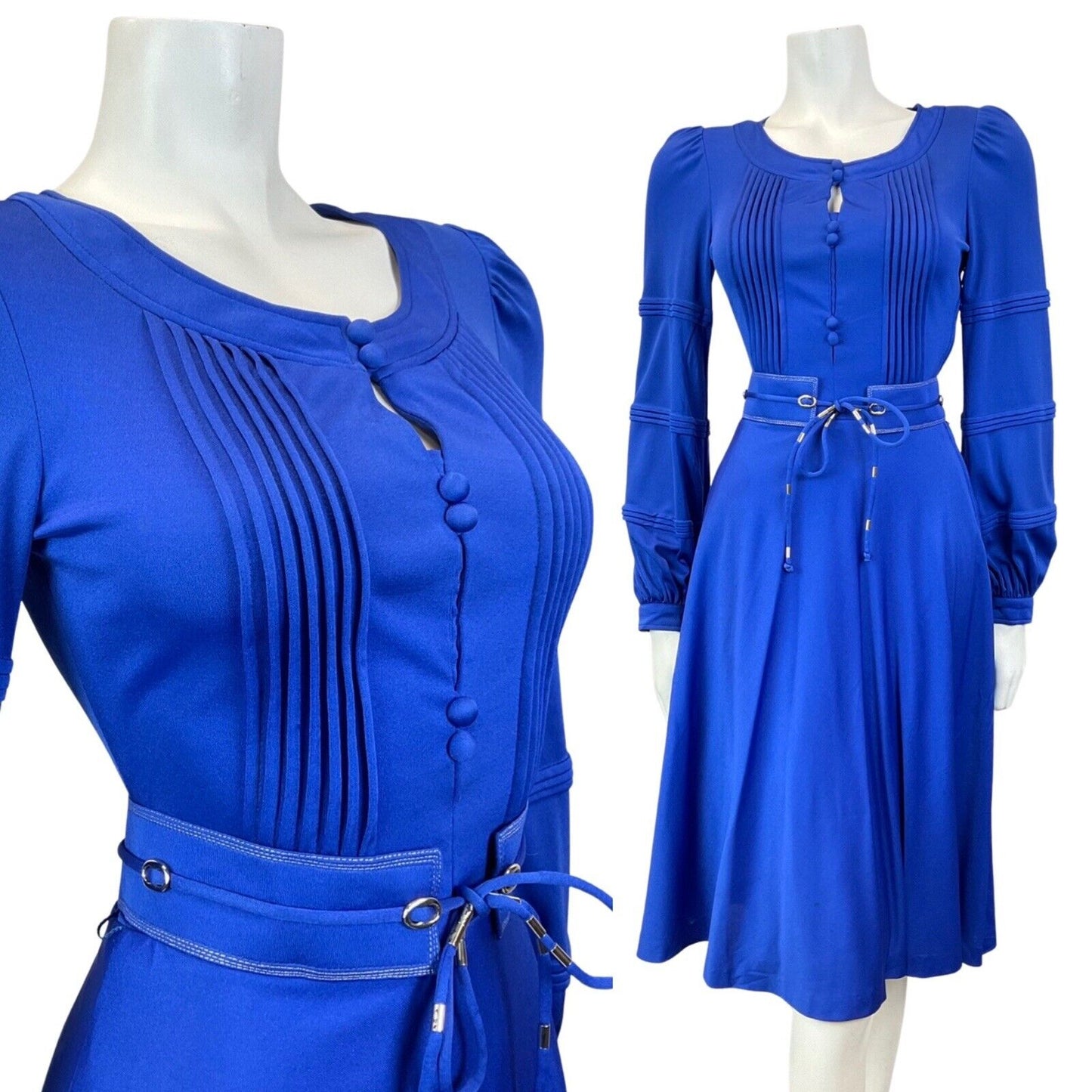 Mannequin wears a bright blue 60s 70s Louis Feraud dress with long sleeves and a matching blue belt